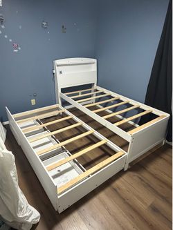 Twin bed with pull out twin bed/ drawers
