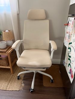 Cream office chair with leg rest
