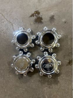 ford f250 f350 set of center caps. 8x170 2 OPENED 2 CLOSED