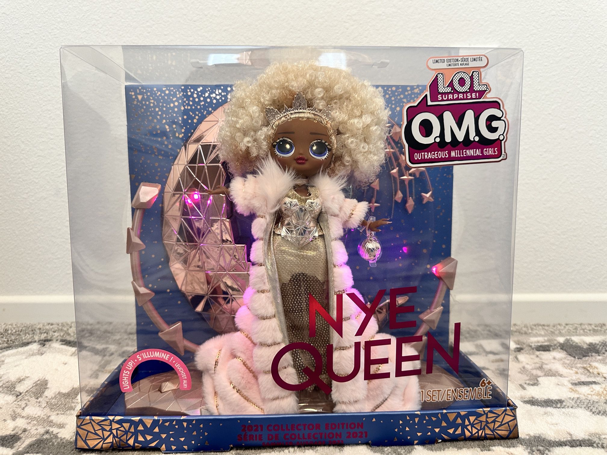 L.O.L. Surprise! Holiday OMG 2021 Collector NYE Queen Fashion Doll with Gold Fashions, Accessories, New Year's Celebration Outfit, Light Up Stand