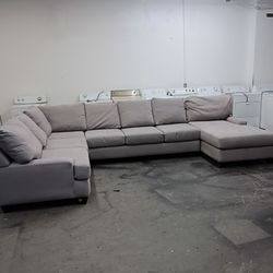 Light grey sectional couch with chaise
