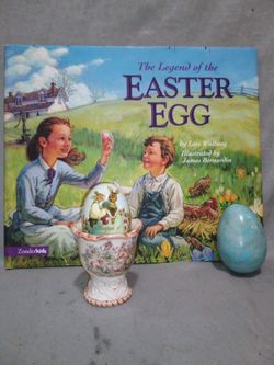 Easter egg holder with marbale rock egg and book