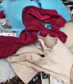 Various new and gently used bras