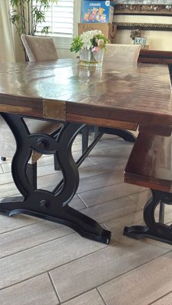 Beautiful industrial style table with bench seating and 4 chairs.