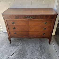 Antique French Mahogany chest of drawers with ornate brass hardware