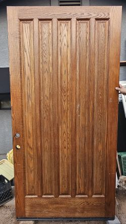 Varnished oak door, 98 1/2 x 49 3/4 inches, with frame. Puerta De Madera Oak Barnizada