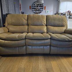 Living Space - Beige color 85" Reclining sofa.