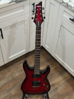 Schecter Demon 6-string in Crimson Red Burst