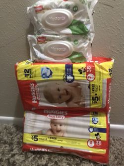 Huggies diapers snug and dry size 2 with 2 packs of wipes