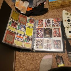 Hundreds Of Football Cards In A Book