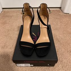 Material Girl black suede high heels in a size 7.5