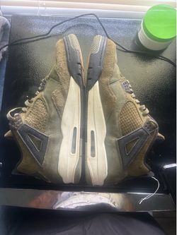 Green and black Jordan 4’s
