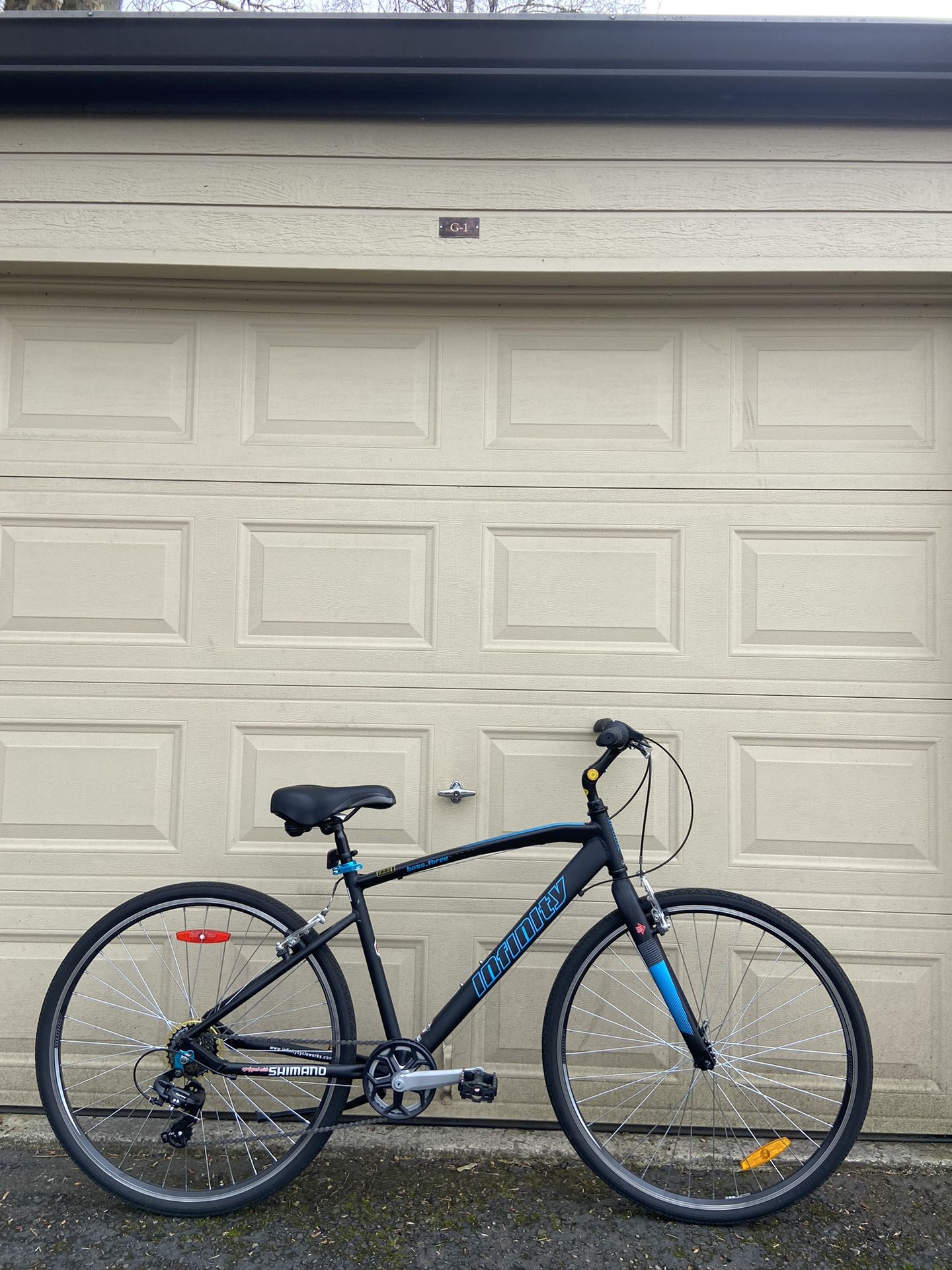Infinity Boss Three 7-Speed Hybrid Bike – 700c Wheels, Matte Black Bicycle