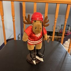 Vintage Collectible Canadian Hockey Figure Featuring A Plush Moose