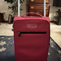 Small Pink Rolling Suitcase 