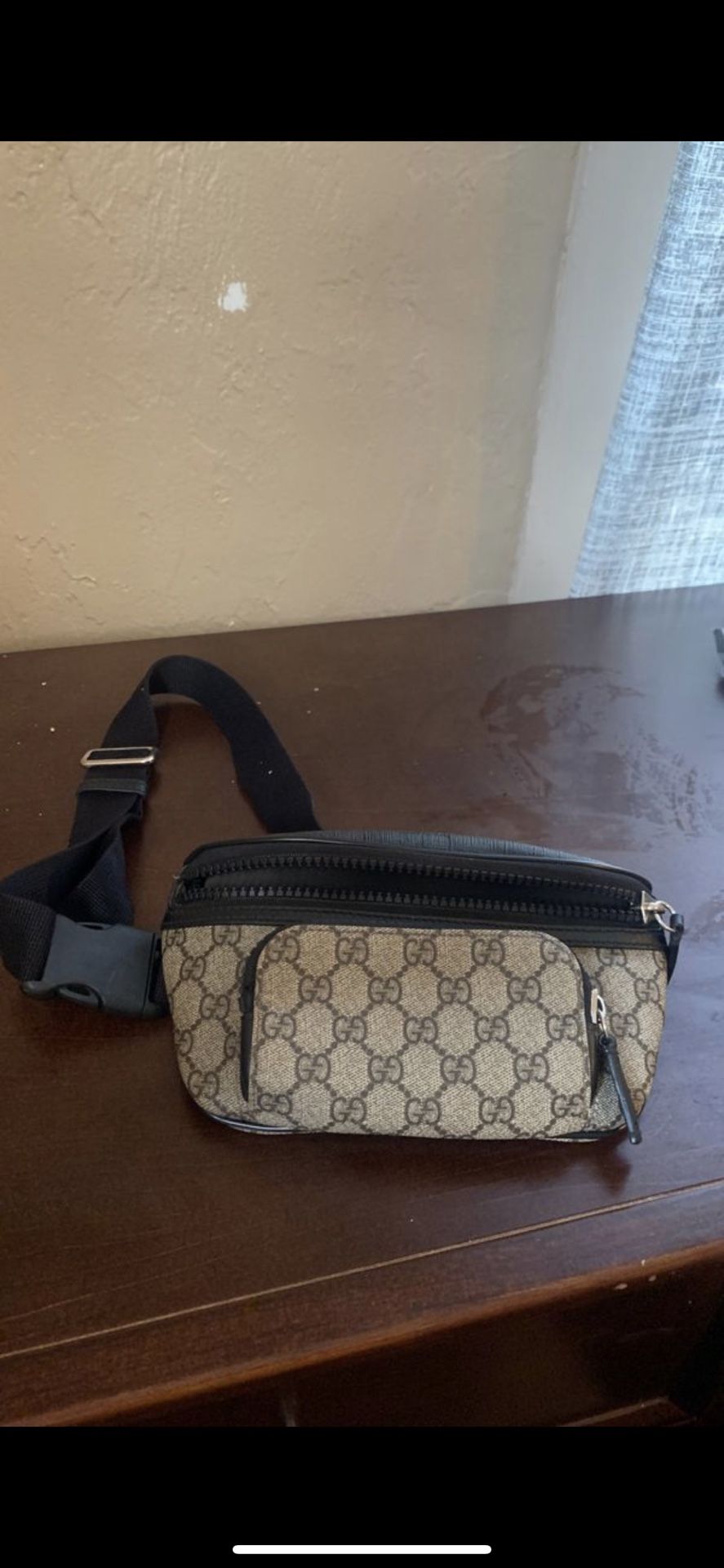 Gucci beige and black GG supreme belt bag