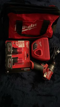 Milwaukee m12 fuel drill , battery’s & charger in bag