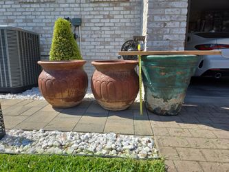 28.5 and 26 inch high clay Pots $200