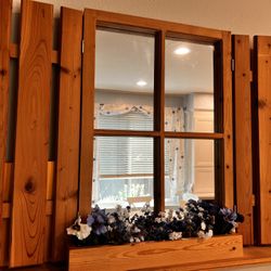 Wooden Window With Mirror and Shutters