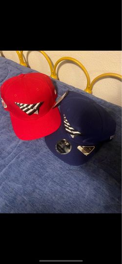 Red and blue Nipsey paper planes hat
