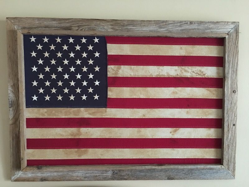 Vintage American flag in wood .