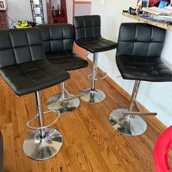 4 leather stools in good condition