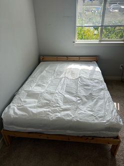 IKEA wooden bed frame + mattress — $150