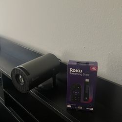 Roku streaming stick and projector