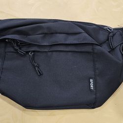 New never used oversized, multiple pocket, cross shoulder, waist, shoulder bag. 