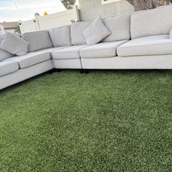 Beautiful, very clean L-shaped sofa in gray.