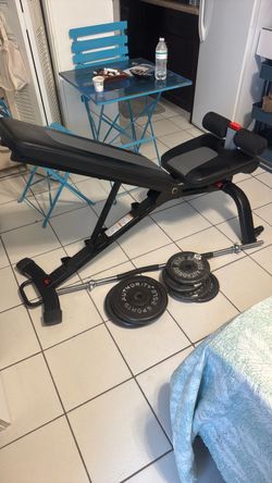 Bow flex, weight, bench, and bars with weight