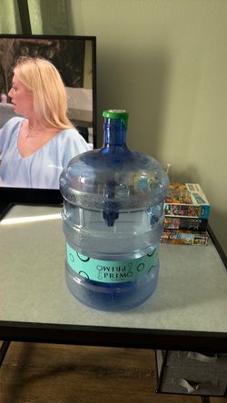 Five 5 gallon water containers empty.