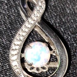 $20. Beautiful  Silver pendant Laced  w/Zirconias &dancing opal