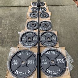 Brand New Full Set Of Cast iron Olympic Plates And Barbell 