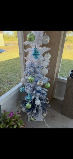 Two White And Blue Christmas Trees