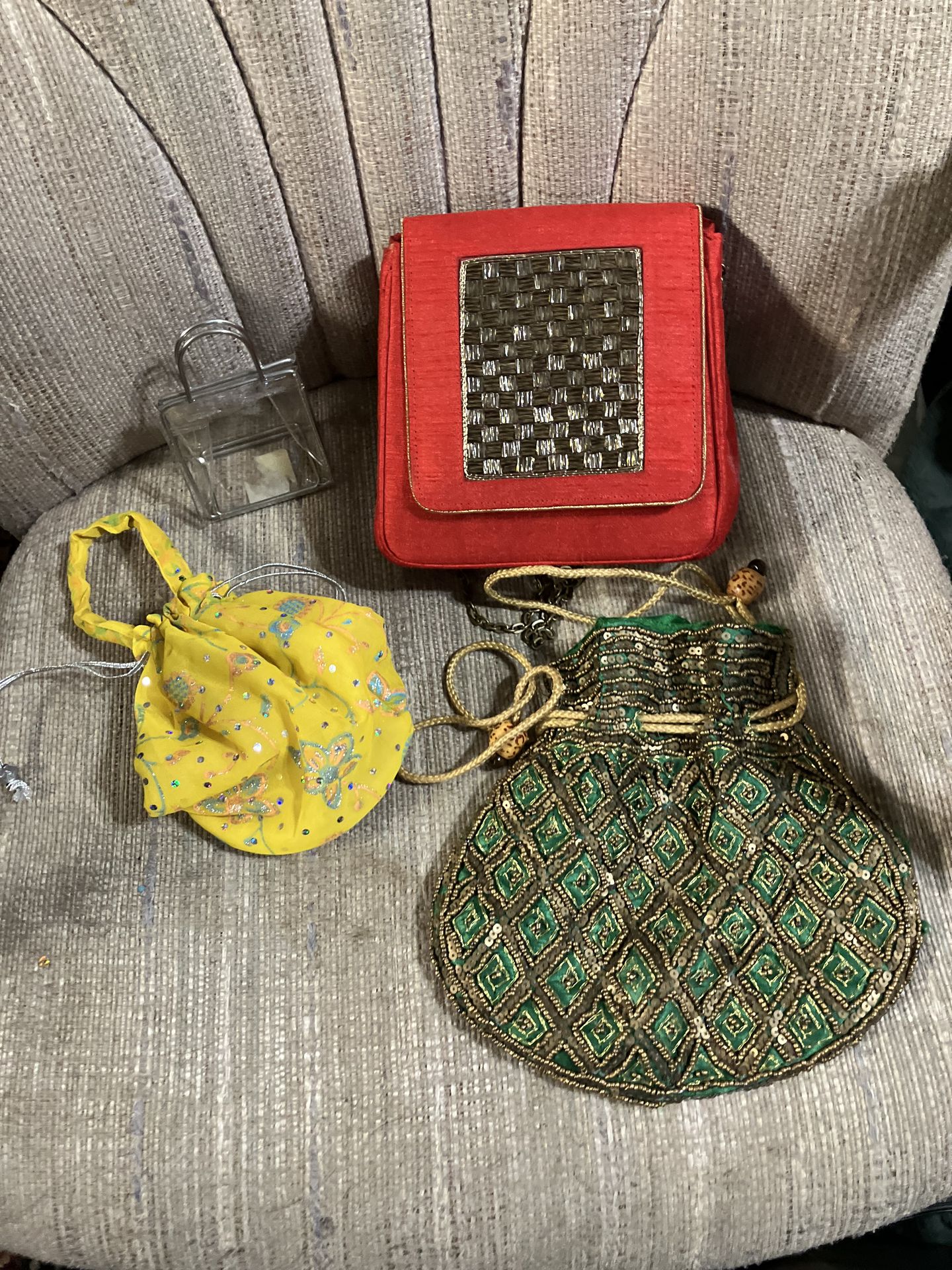Four purses as shown in the picture .