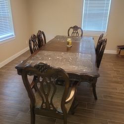 Wooden dining table with 6 chairs