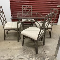 Glass top table with 4 chairs