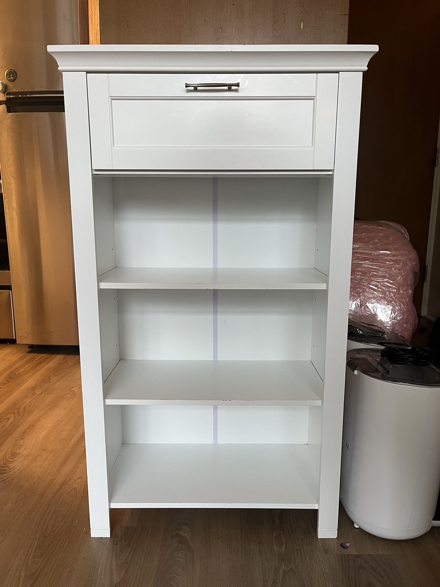 white narrow entryway bookshelf