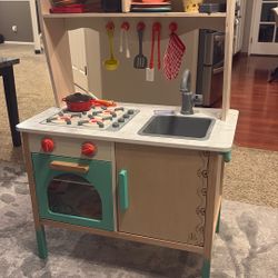 Wooden Kids Kitchen With It’s Tools And Food
