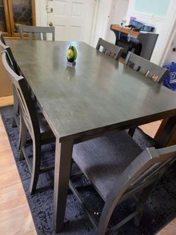 Dark wood table with 6 chairs