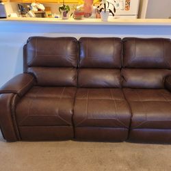 Brown leather sofa and loveseat  recliner with USB insured for 5 years