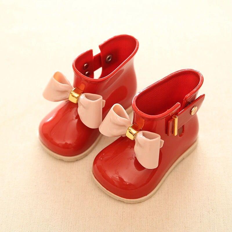 Red jelly boots with minor stains