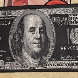 All black hundred dollar bill rug