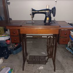 Vintage Singer Treadle Sewing machine, cabinet and attachments