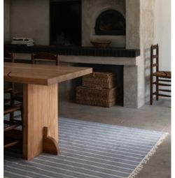 Like new, light blue stripe Nordic Knot Rug 6x9