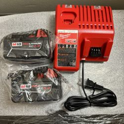 Two Milwaukee M18 Red Lithium XC 5 Hr Batteries with Charger