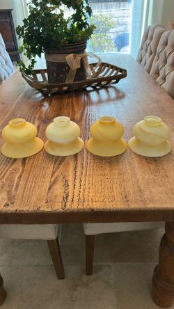 Four bathroom sconces, beautiful pale yellow color