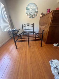 Furniture , metal bed , mattress, coffee table .