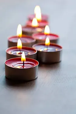 Small red candles with a dim light, burn for 8 hours, and have no odor.